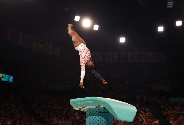 Simone Biles competes in the vault during the women's gymnastics team final at the Olympics in Paris on July 30, 2024.