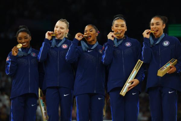 
Gold medallist's Simone Biles of United States, Jordan Chiles of United States, Jade Carey of United States, Sunisa Lee of United States and Hezly Rivera of United States celebrate with their medals on the podium. 