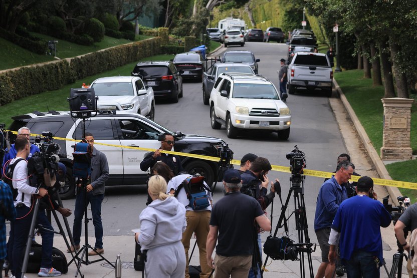 Police and members of the media gather outside the home of US producer and musician Sean "Diddy" Combs in Los Angeles on March 25, 2024. Homes belo<em></em>nging to Sean "Diddy" Combs were being raided by federal agents, media reported on March 25, with the US hip hop mogul at the center of sex trafficking and sex assault lawsuits. (Photo by David SWANSON / AFP) (Photo by DAVID SWANSON/AFP via Getty Images)