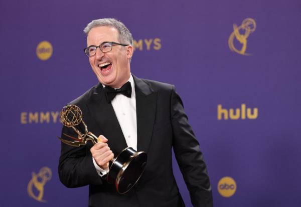 John Oliver poses with the Outstanding s<em></em>cripted Variety Series award for "Last Week To<em></em>night with John Oliver" at the 76th Primetime Emmy Awards