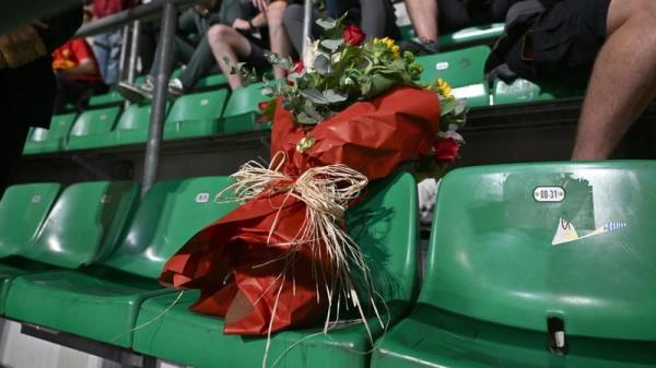 Supporters at the San Siro placed flowers on the seat of the Liverpool fan who died