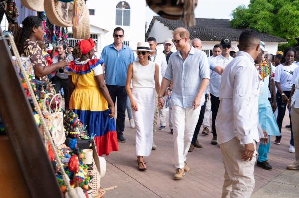 Britain's Prince Harry, Duke of Sussex, and Britain's Meghan, Duchess of Sussex, pose for a photo as they attend the program held in the Armed Forces Complex in Abuja, Nigeria on May 11, 2024. 