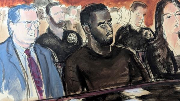 Sean Combs, center, is flanked by his defense attorney Marc Agnifilo, left, and Teny Garagos, in Manhattan Federal Court on Tuesday.