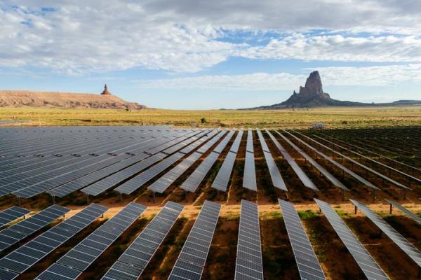 In an aerial view, the Kayenta Solar Plant is seen on June 23, 2024, in Kayenta, Arizona. The Federal Reserve’s decision Wednesday to start cutting interest rates could bolster green energy investments like solar energy.